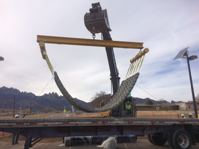 a crane is lifting a construction mat